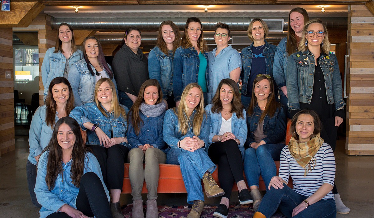 Wisetail LMS female employees gather in the Wisetail headquarters.