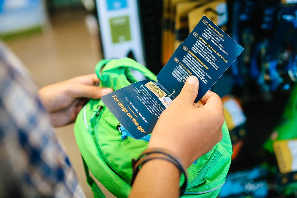 A customer takes a look at a product during a retail training exercise.