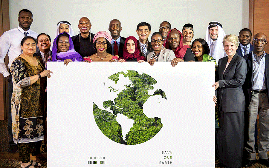 Nonprofit employees in front of globe image